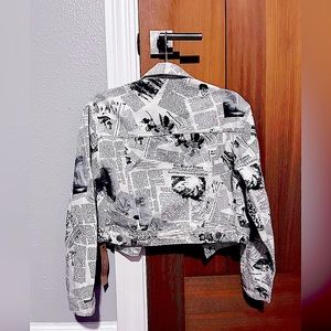 Reformation jean jacket in climate newsprint